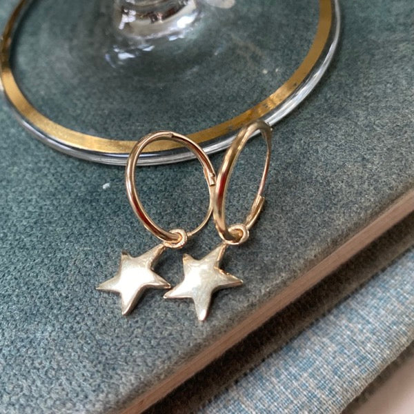 Solid Gold Tiny Star Earrings by Joy Everley