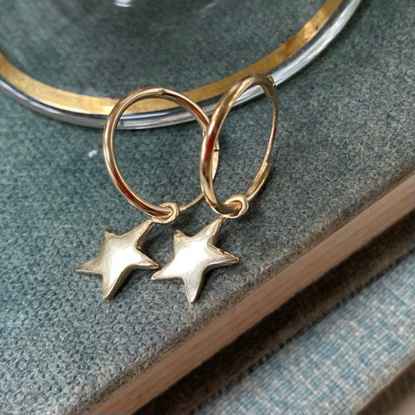Solid Gold Tiny Star Earrings by Joy Everley