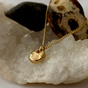 Solid Gold Tiny Rough Pebble Necklace by Joy Everley