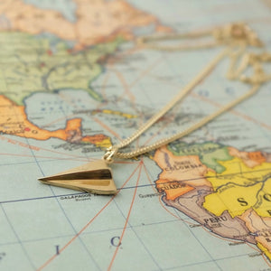 Solid Gold Paper Plane by Joy Everley