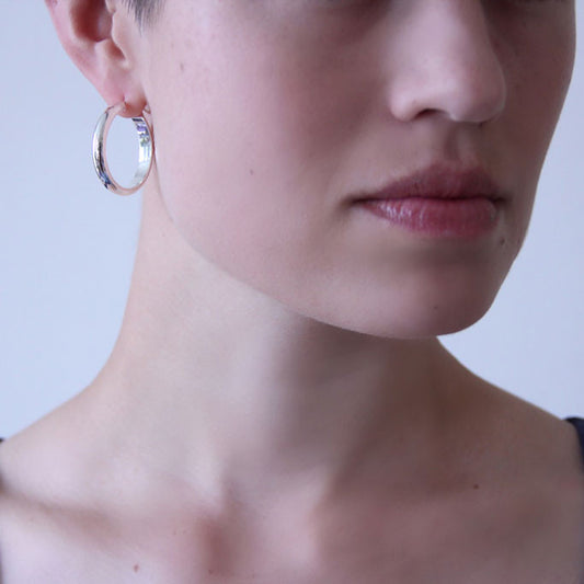 Silver d-section hoops on body