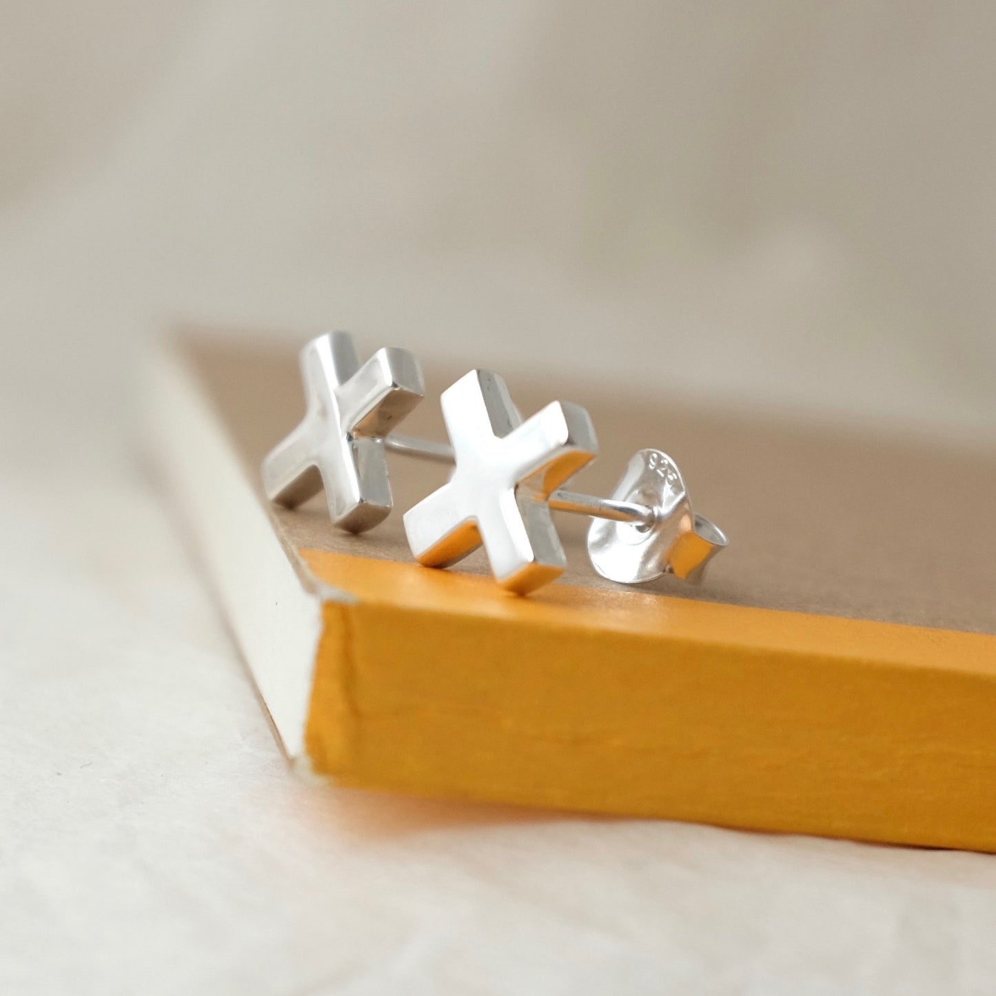 Silver Kiss Cross Ear Studs by Joy Everley